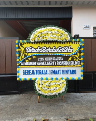 Papan Bunga Duka di Sadananya